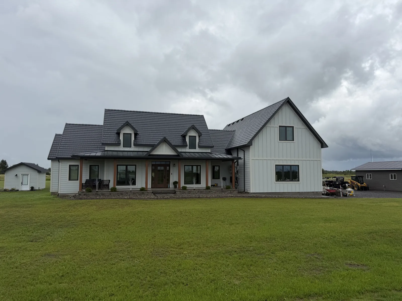 Custom farmhouse home with metal roof