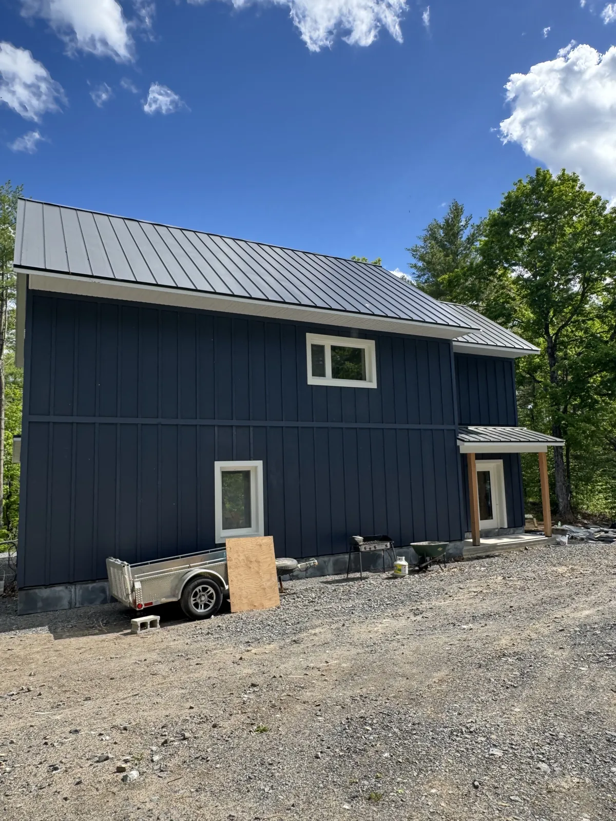 New home with board and batten siding and wraparound porch