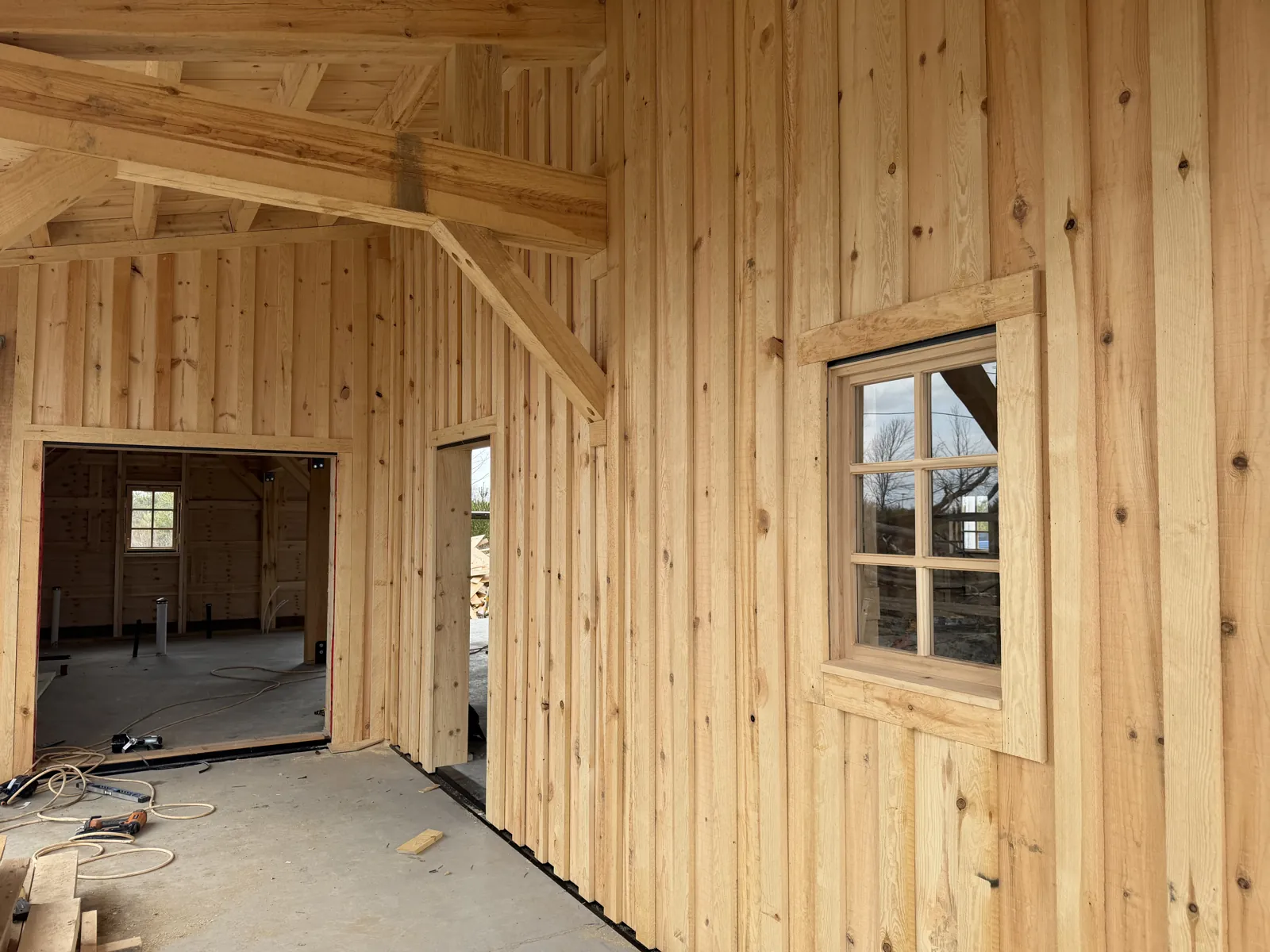 Timber frame building under construction in winter